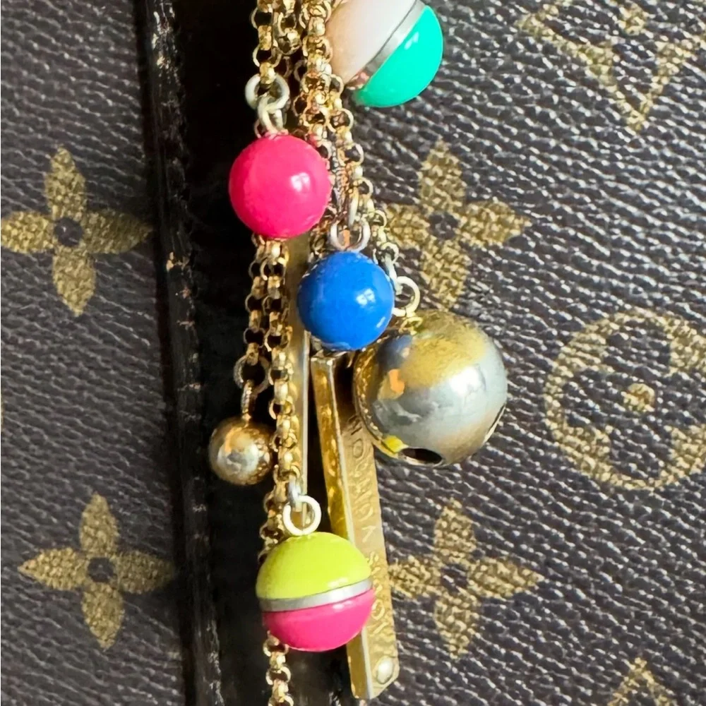 Authentic Louis Vuitton Porte Cles grelots bag charm and key holder